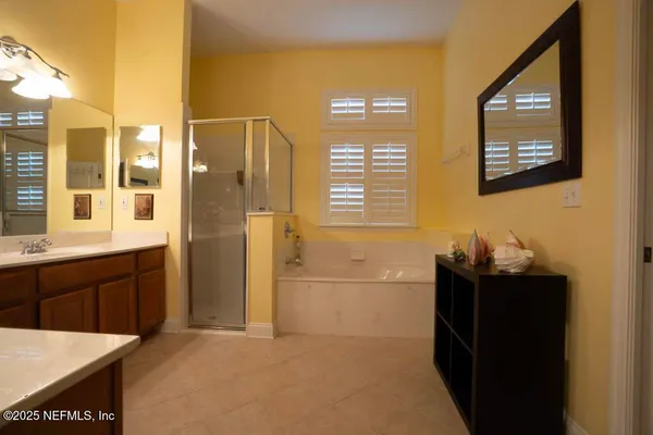 a bedroom with a bed and a cabinets