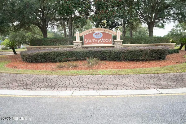 a view of a street with a park