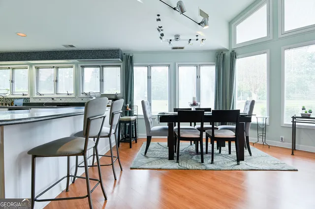 a view of a dining room with furniture window and outside view