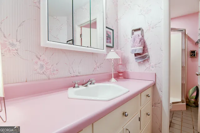 a bathroom with a sink and a mirror