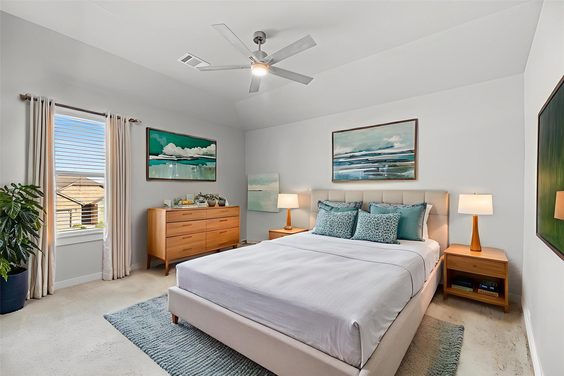 1600 Del Sol Rdg Lane Katy, TX 77493 - Photo 18 of 28 a bedroom with a bed a dresser and a flat screen tv