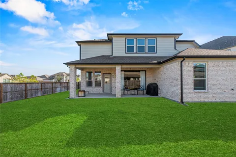 a view of a house with a yard porch and sitting area