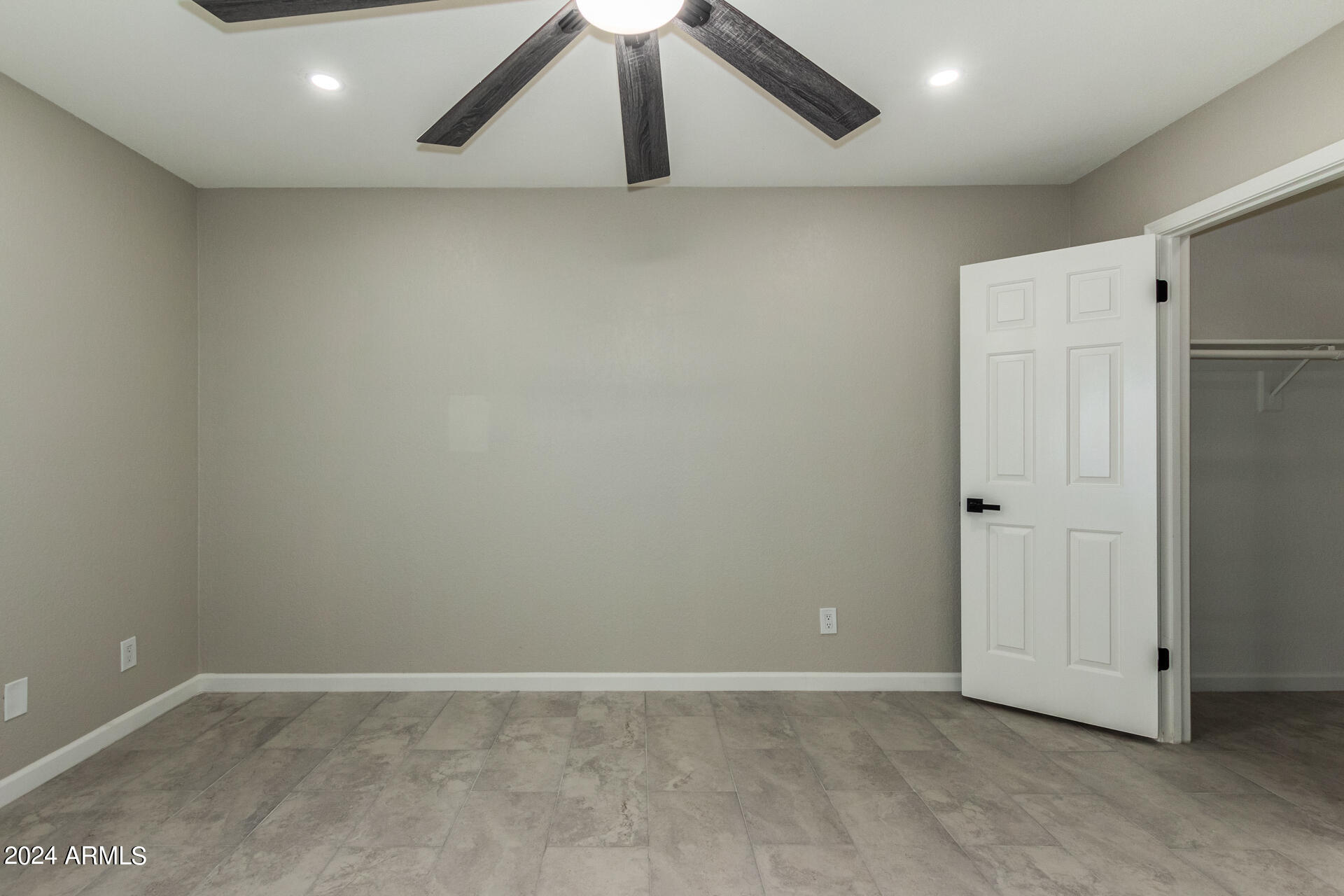 1734 West Banff Ln. Phoenix, AZ 85023 - Photo 17 of 44 an empty room with wooden floor and windows