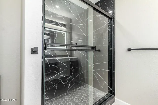 a view of a swimming pool with a chair