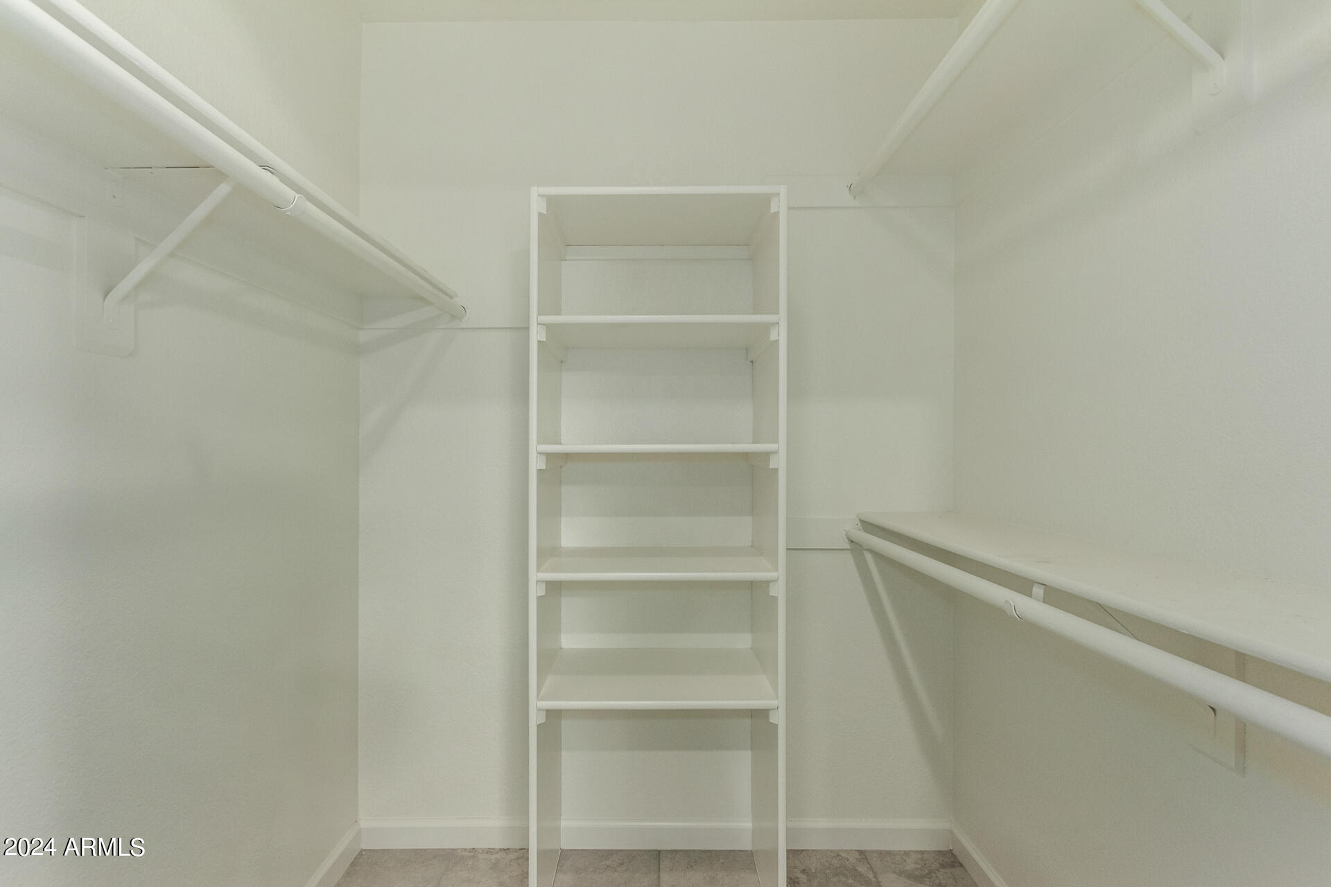 1734 West Banff Ln. Phoenix, AZ 85023 - Photo 20 of 44 a view of walk in closet with empty racks