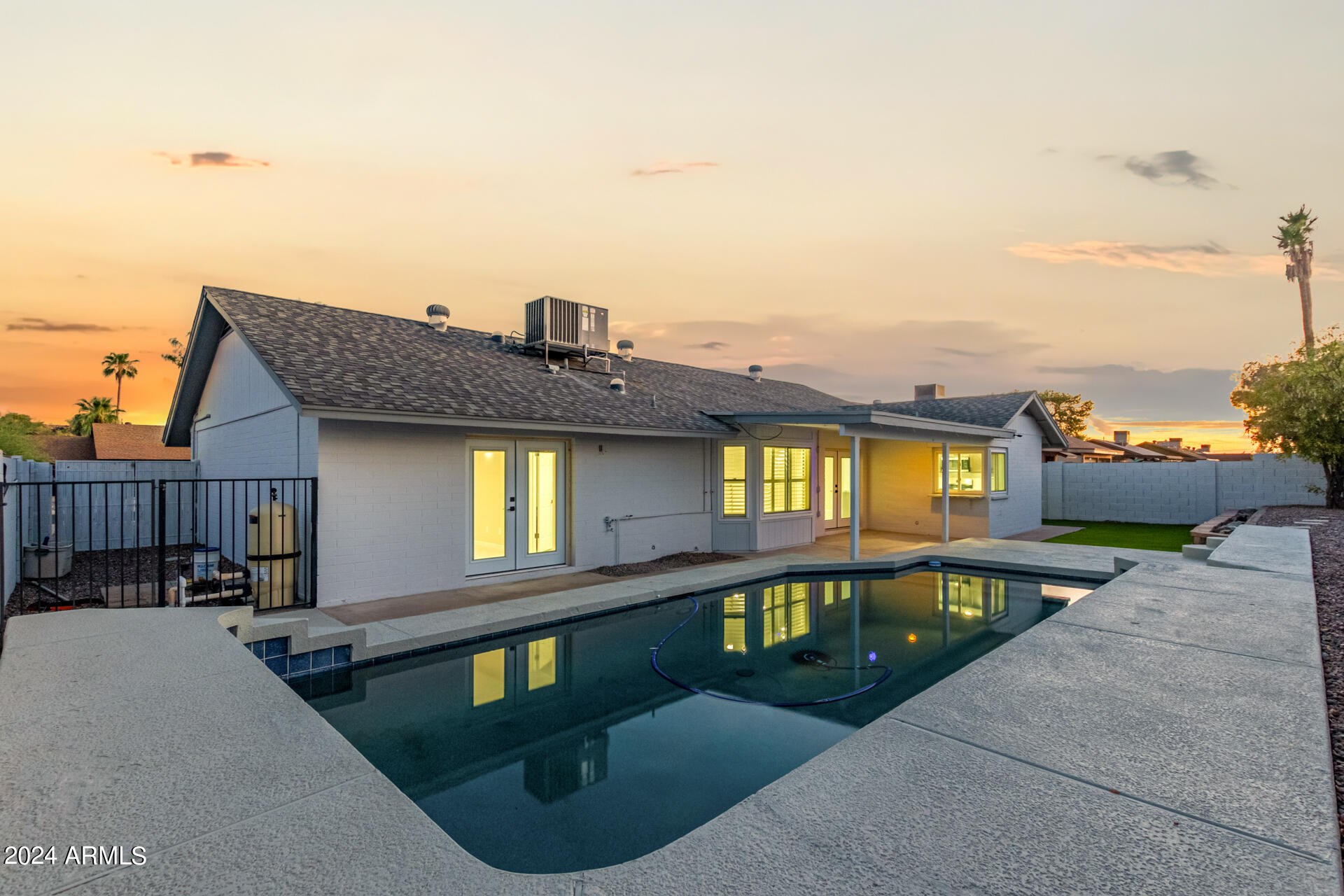 1734 West Banff Ln. Phoenix, AZ 85023 - Photo 32 of 44 a view of a brick house with many windows