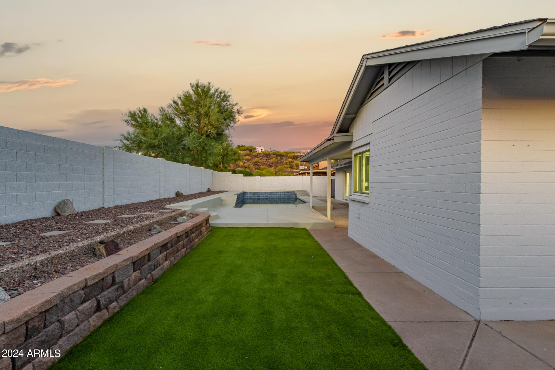 1734 West Banff Ln. Phoenix, AZ 85023 - Photo 33 of 44 a view of a backyard with sitting area
