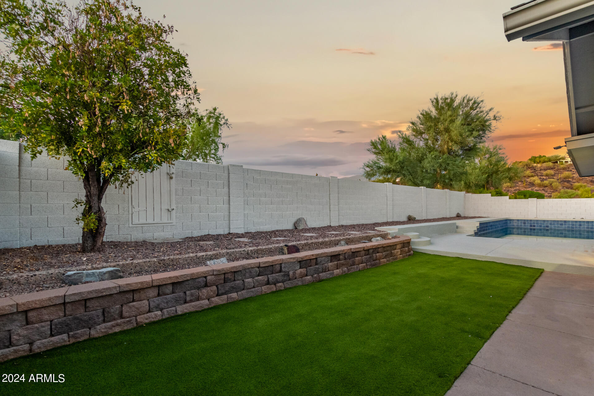 1734 West Banff Ln. Phoenix, AZ 85023 - Photo 34 of 44 a backyard of a house with lots of green space