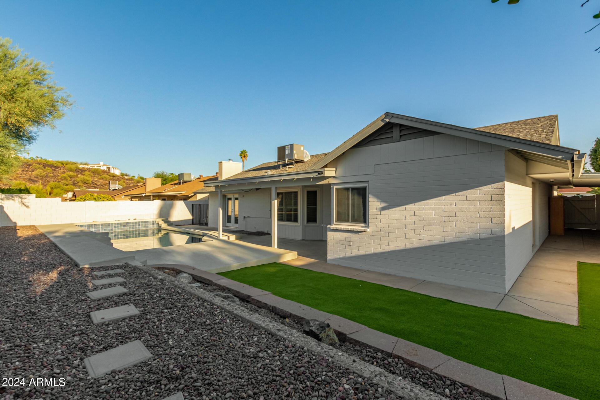 1734 West Banff Ln. Phoenix, AZ 85023 - Photo 37 of 44 a front view of a house with a yard