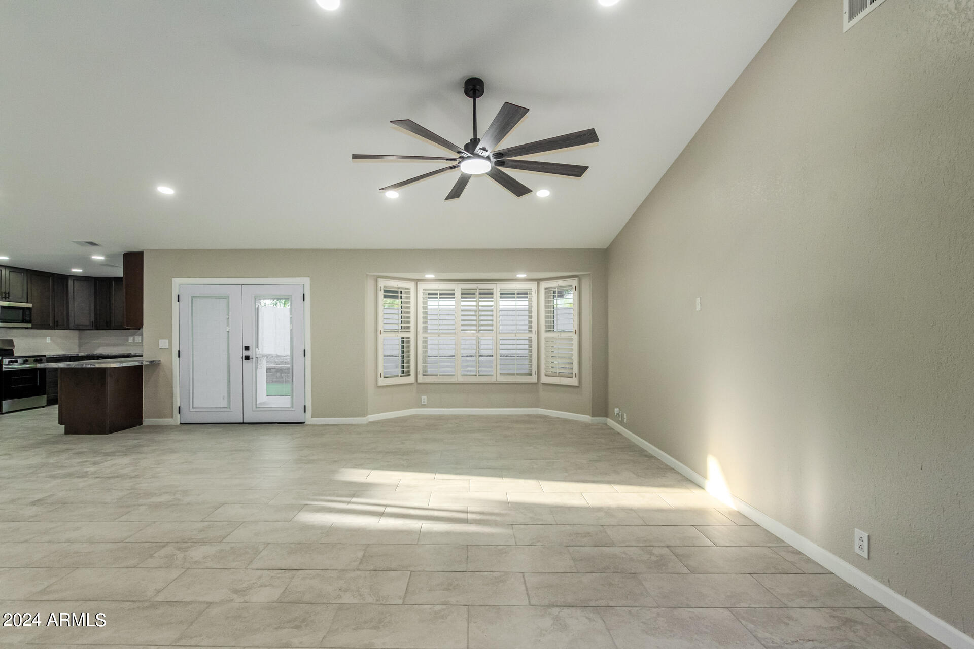 1734 West Banff Ln. Phoenix, AZ 85023 - Photo 9 of 44 a view of a livingroom with a ceiling fan and windows