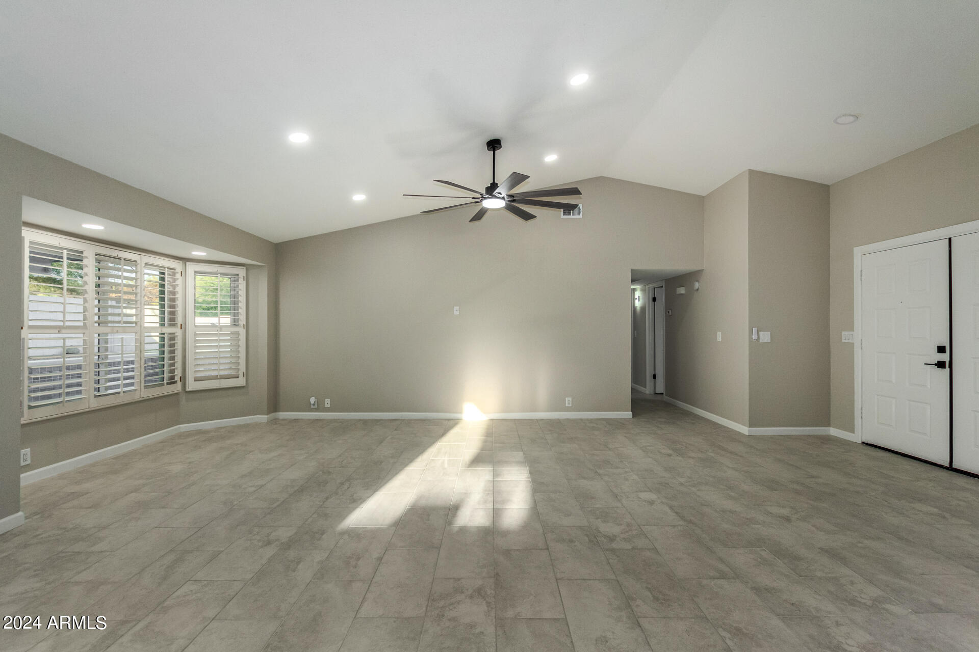 1734 West Banff Ln. Phoenix, AZ 85023 - Photo 10 of 44 a view of an empty room with a window