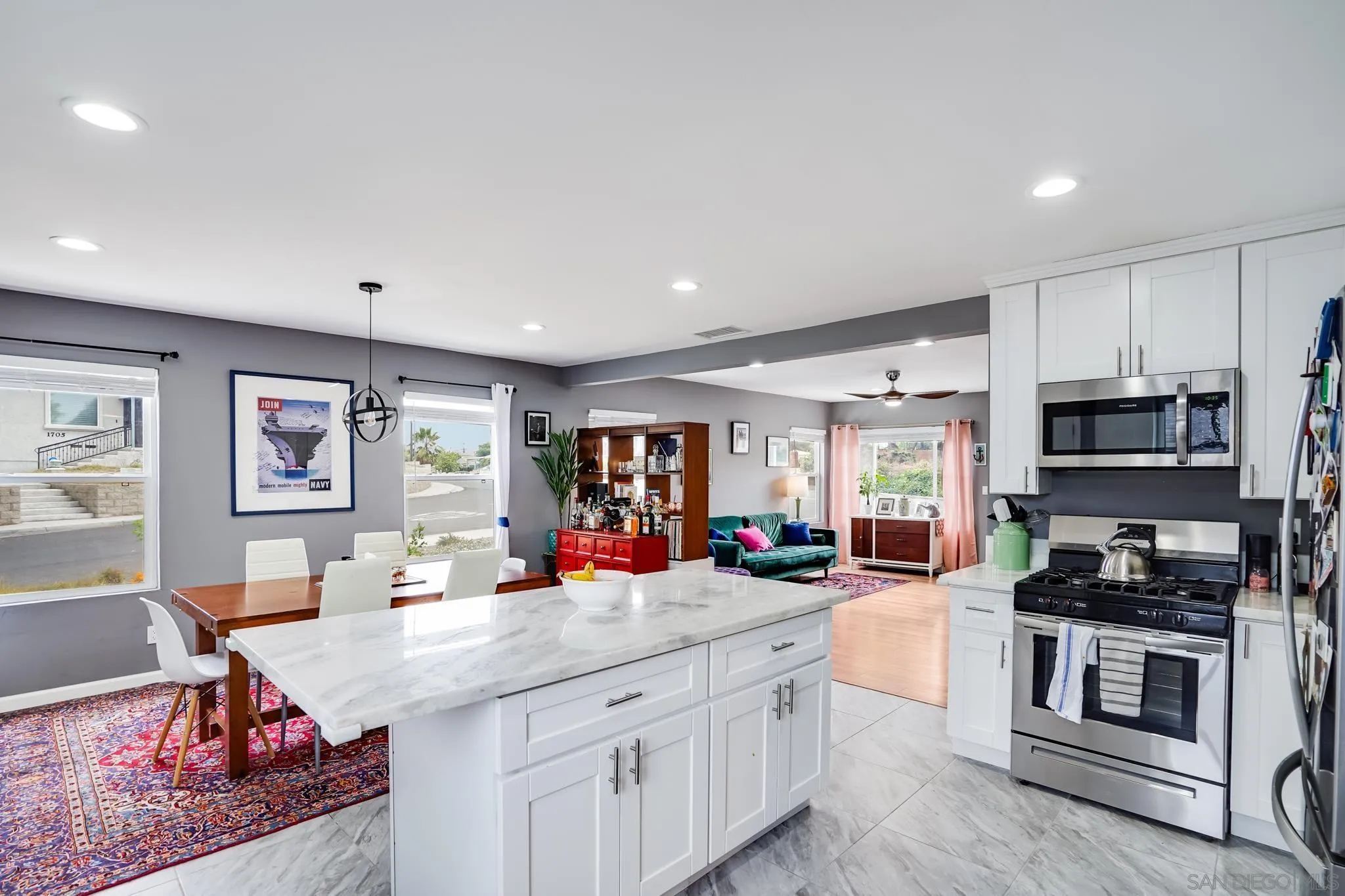 7690 Canton Drive Lemon Grove, CA 91945 - Photo 12 of 41 a kitchen with stainless steel appliances granite countertop a sink stove and cabinets