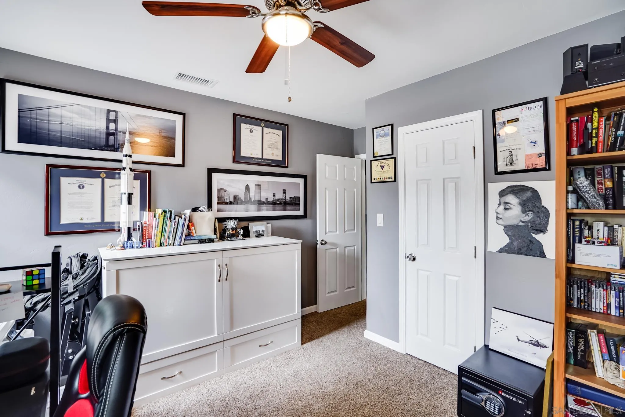 7690 Canton Drive Lemon Grove, CA 91945 - Photo 32 of 41 a view of a workspace with furniture and cabinet