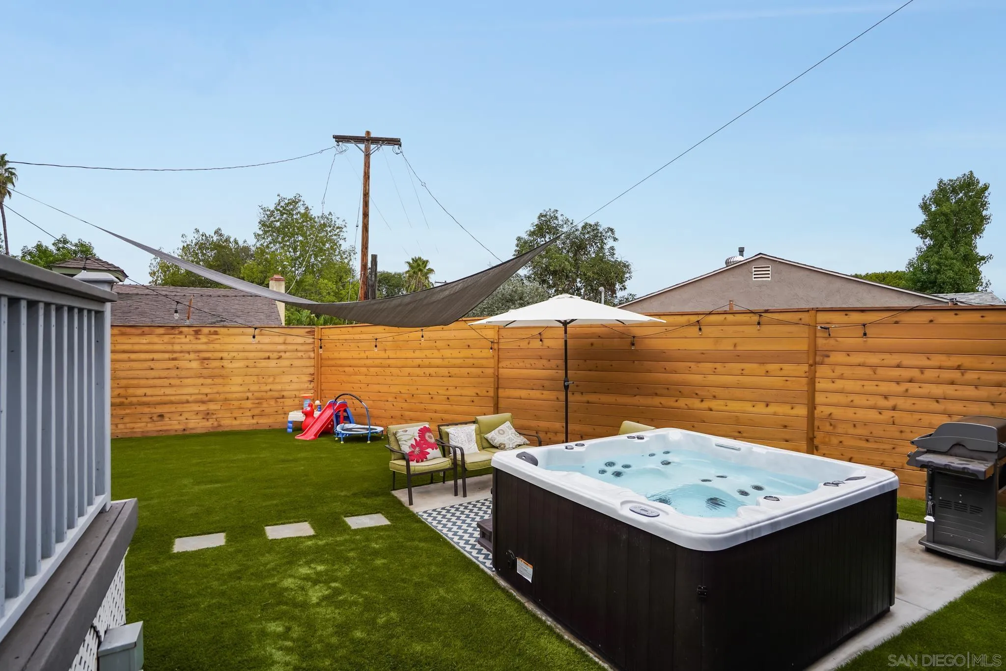 7690 Canton Drive Lemon Grove, CA 91945 - Photo 34 of 41 a view of a terrace with a table and chairs