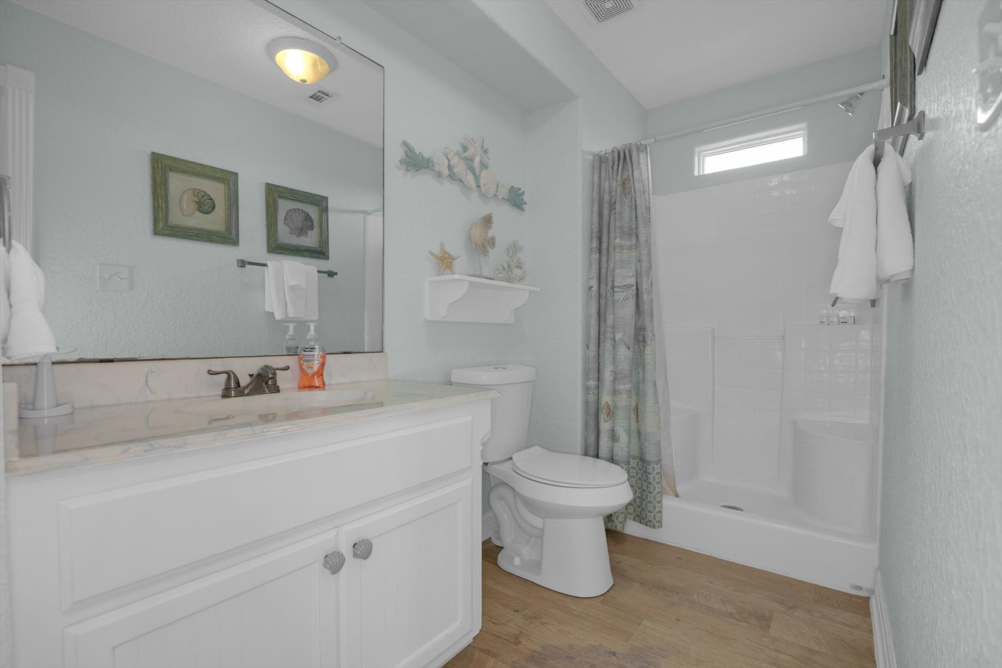 422 Jettyview Road Freeport, TX 77541 - Photo 11 of 37 a bathroom with a sink toilet a mirror and shower