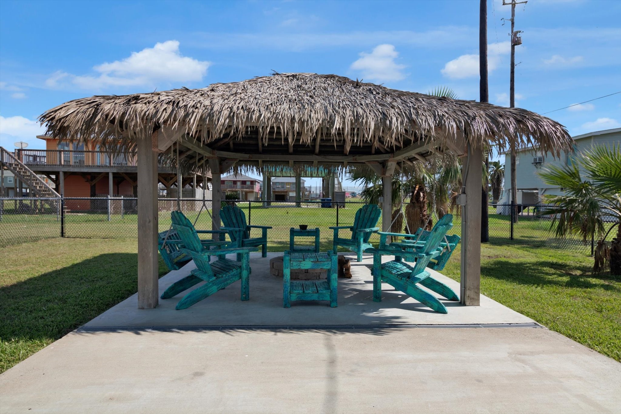 422 Jettyview Road Freeport, TX 77541 - Photo 27 of 37 a view of a chairs and table in patio with a fire pit
