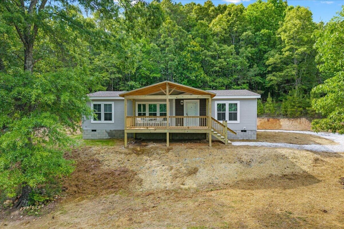 1629 Wasson Road Ten Mile, TN 37880 - Photo 2 of 27 a house view with a garden space