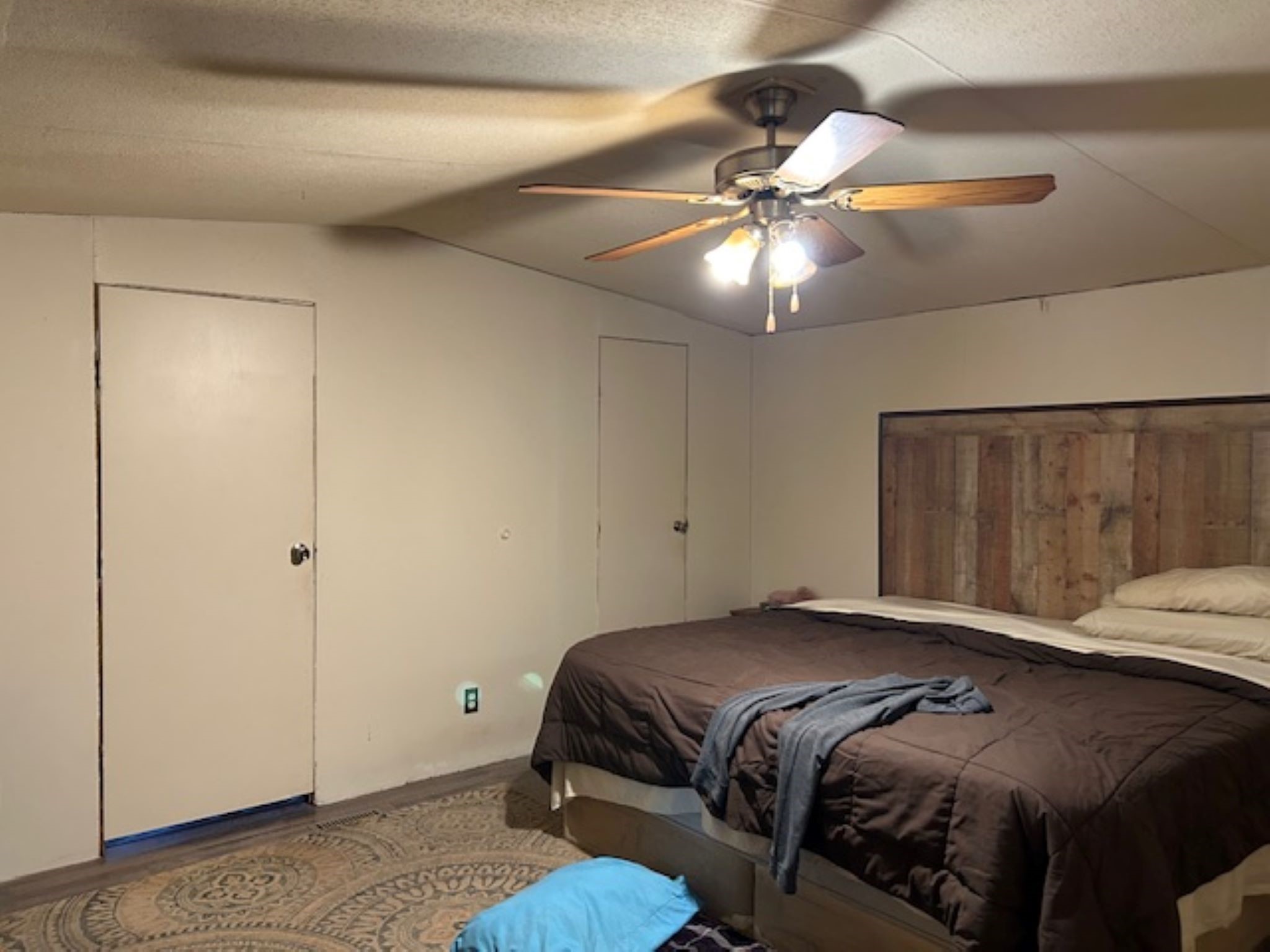 30996 Strathmore Road Waller, TX 77484 - Photo 11 of 20 a bedroom with a bed and a ceiling fan