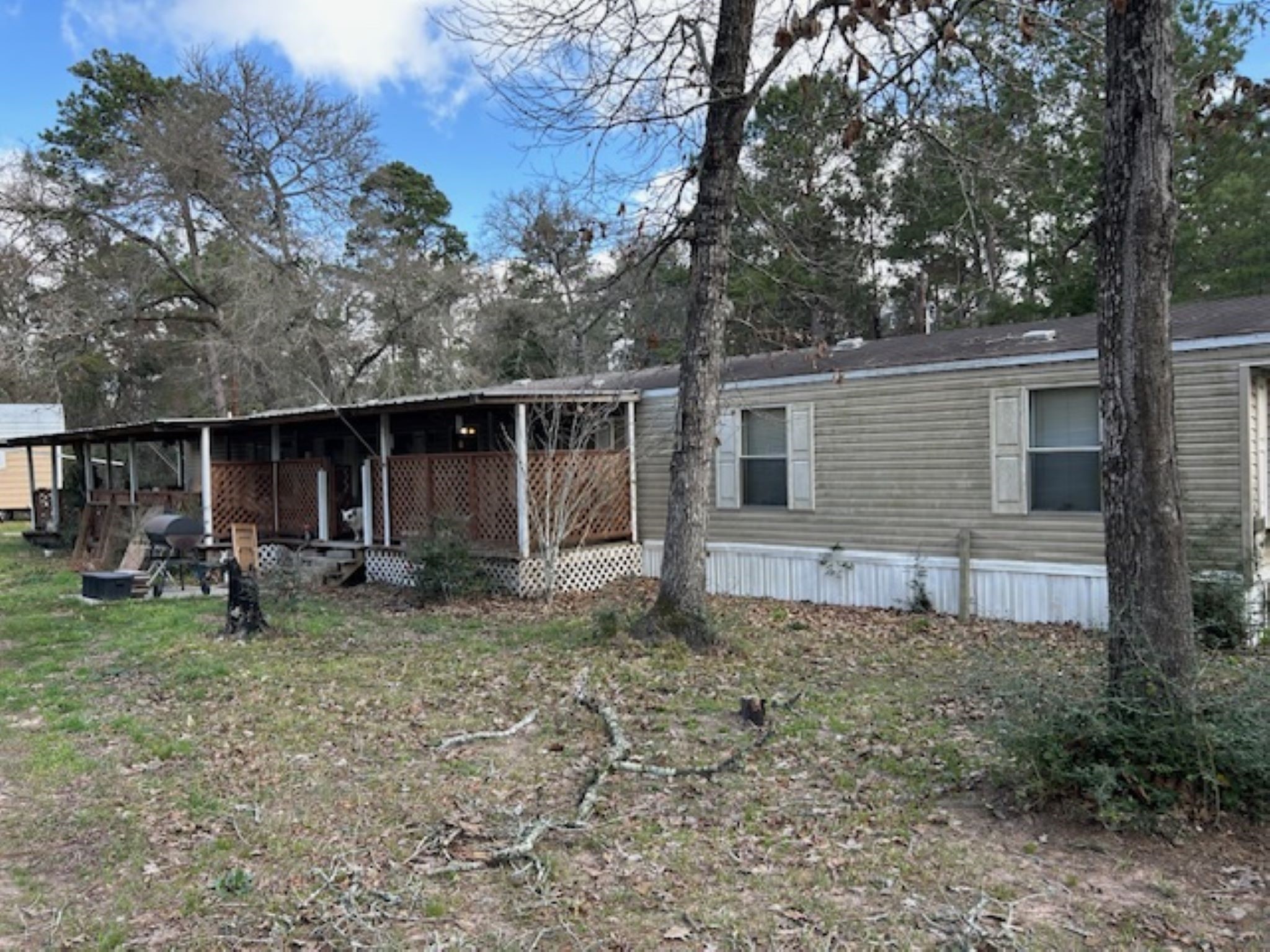 30996 Strathmore Road Waller, TX 77484 - Photo 4 of 20 a house with trees in the background