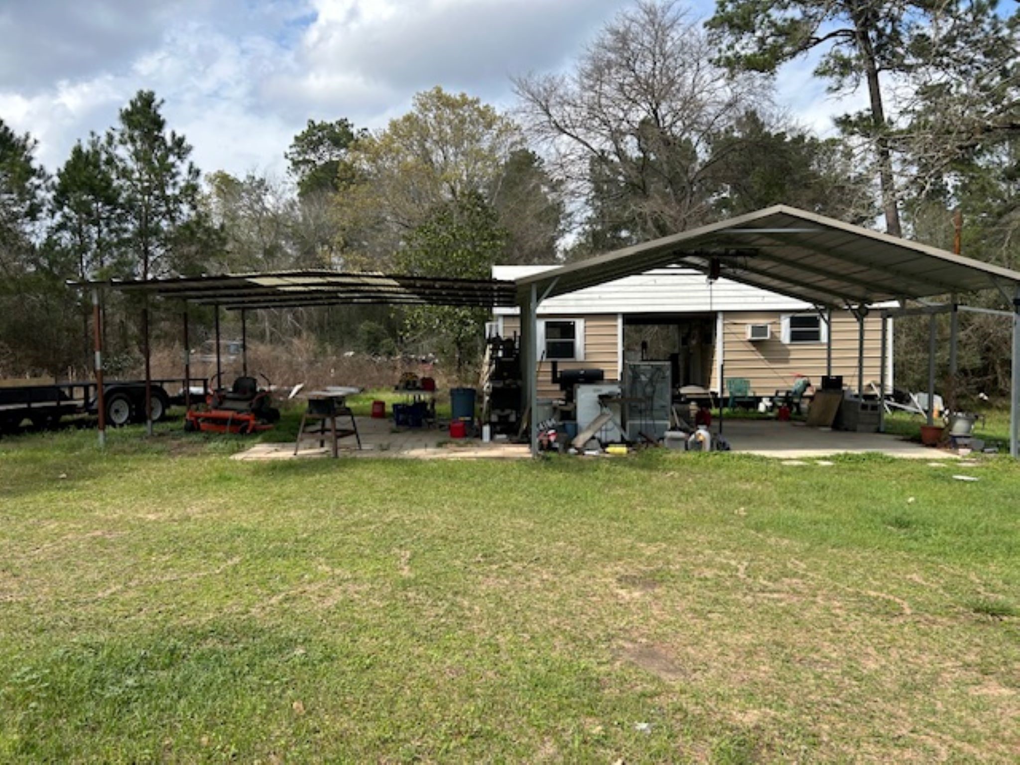 30996 Strathmore Road Waller, TX 77484 - Photo 7 of 20 a backyard of a house with barbeque oven table and chairs