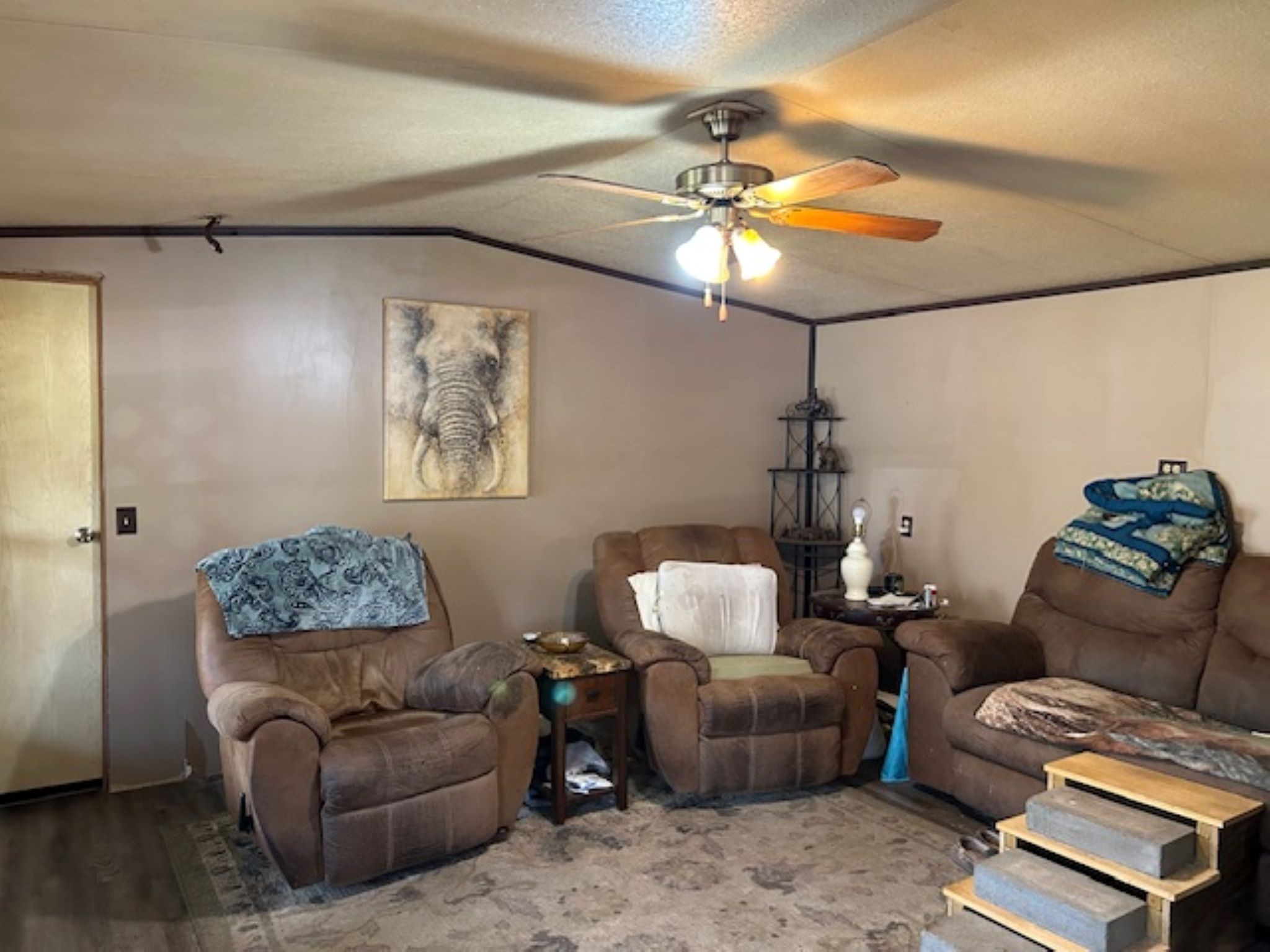 30996 Strathmore Road Waller, TX 77484 - Photo 9 of 20 a living room with furniture and a chandelier
