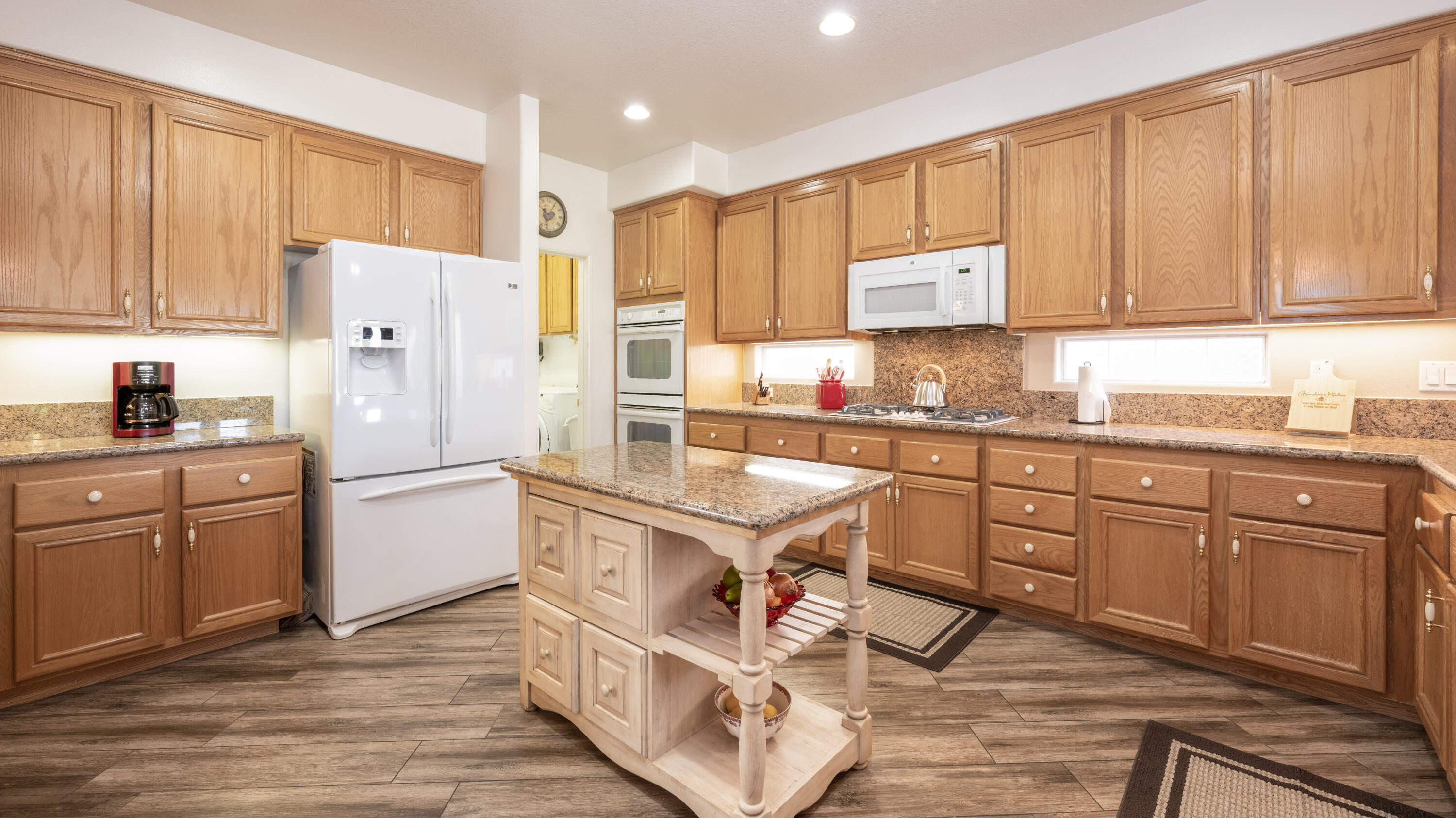 80432 Pebble Beach Drive Indio, CA 92201 - Photo 12 of 46 a kitchen with granite countertop cabinets and refrigerator