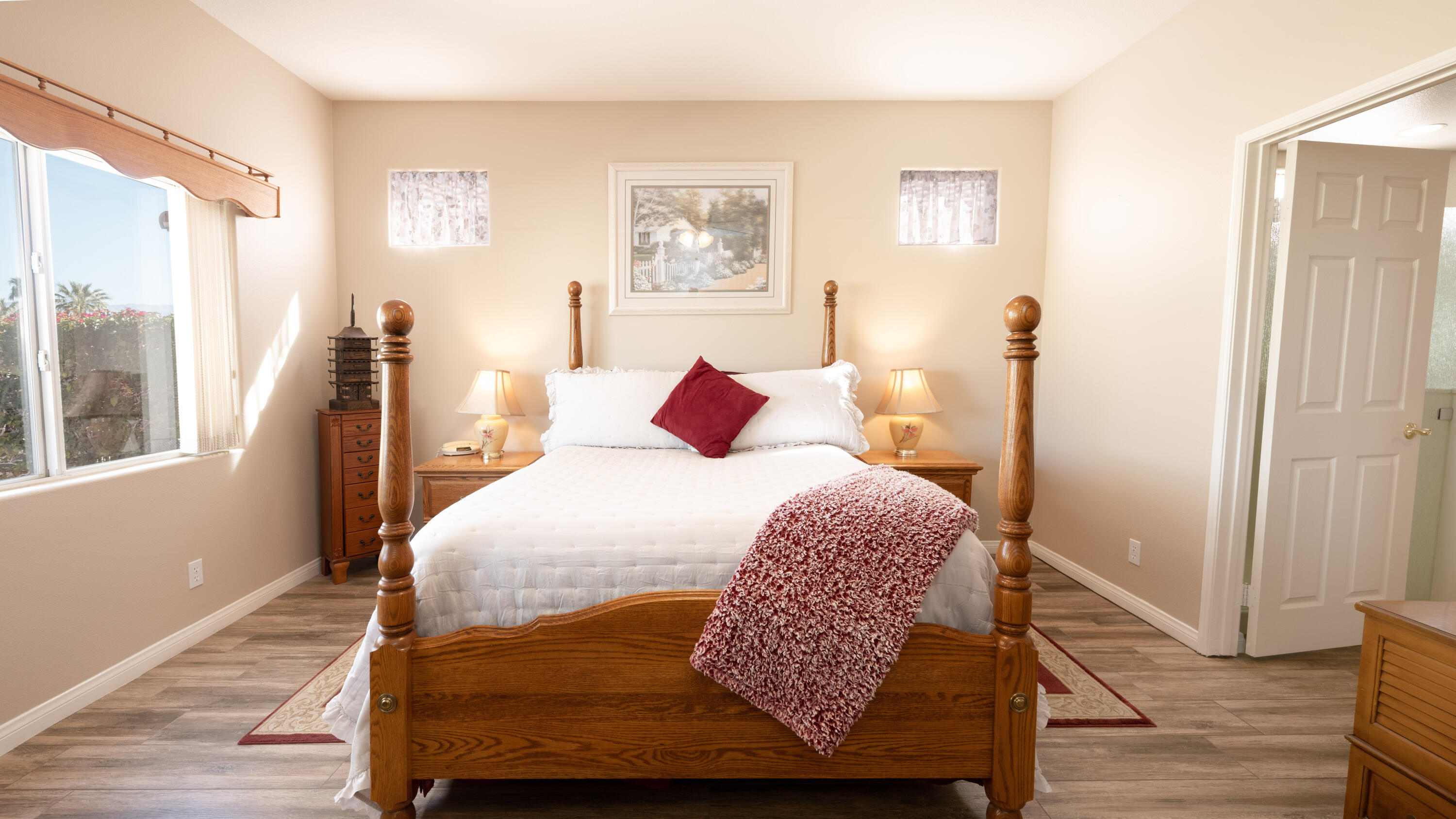 80432 Pebble Beach Drive Indio, CA 92201 - Photo 17 of 46 a bedroom with a bed and wooden floor