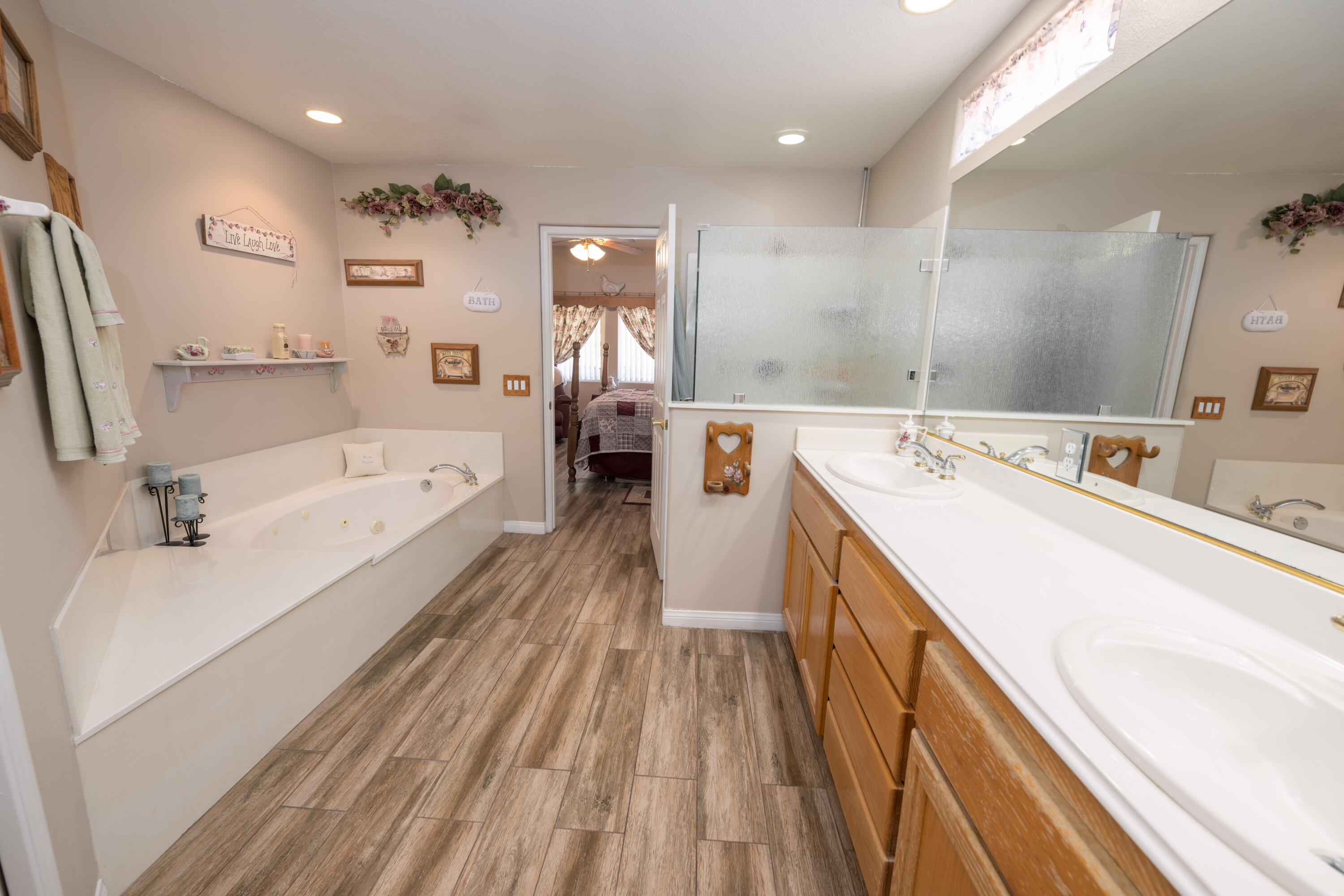 80432 Pebble Beach Drive Indio, CA 92201 - Photo 19 of 46 a spacious bathroom with a tub double vanity sink and mirror