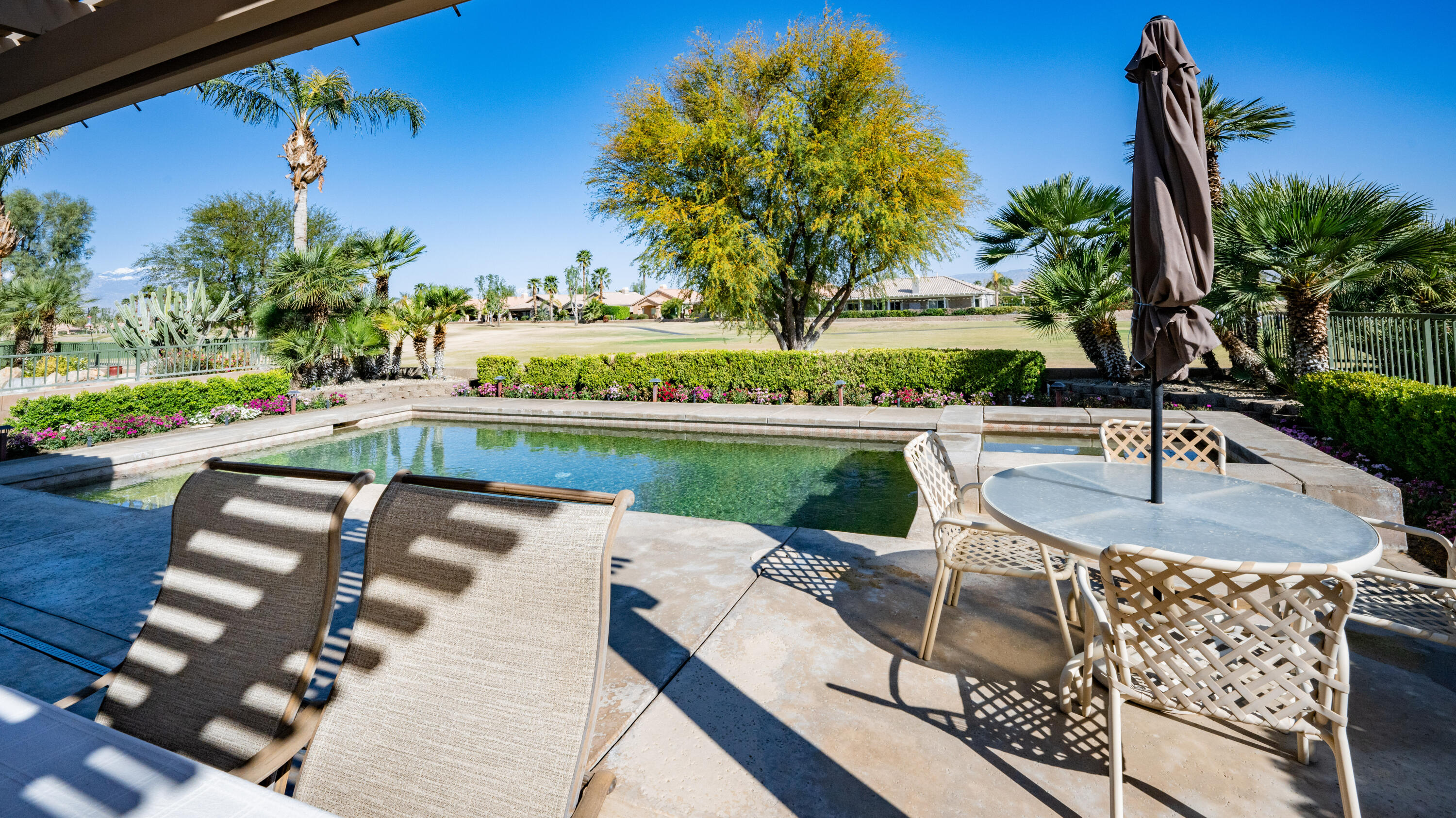 80432 Pebble Beach Drive Indio, CA 92201 - Photo 27 of 46 a view of swimming pool with outdoor seating and plants