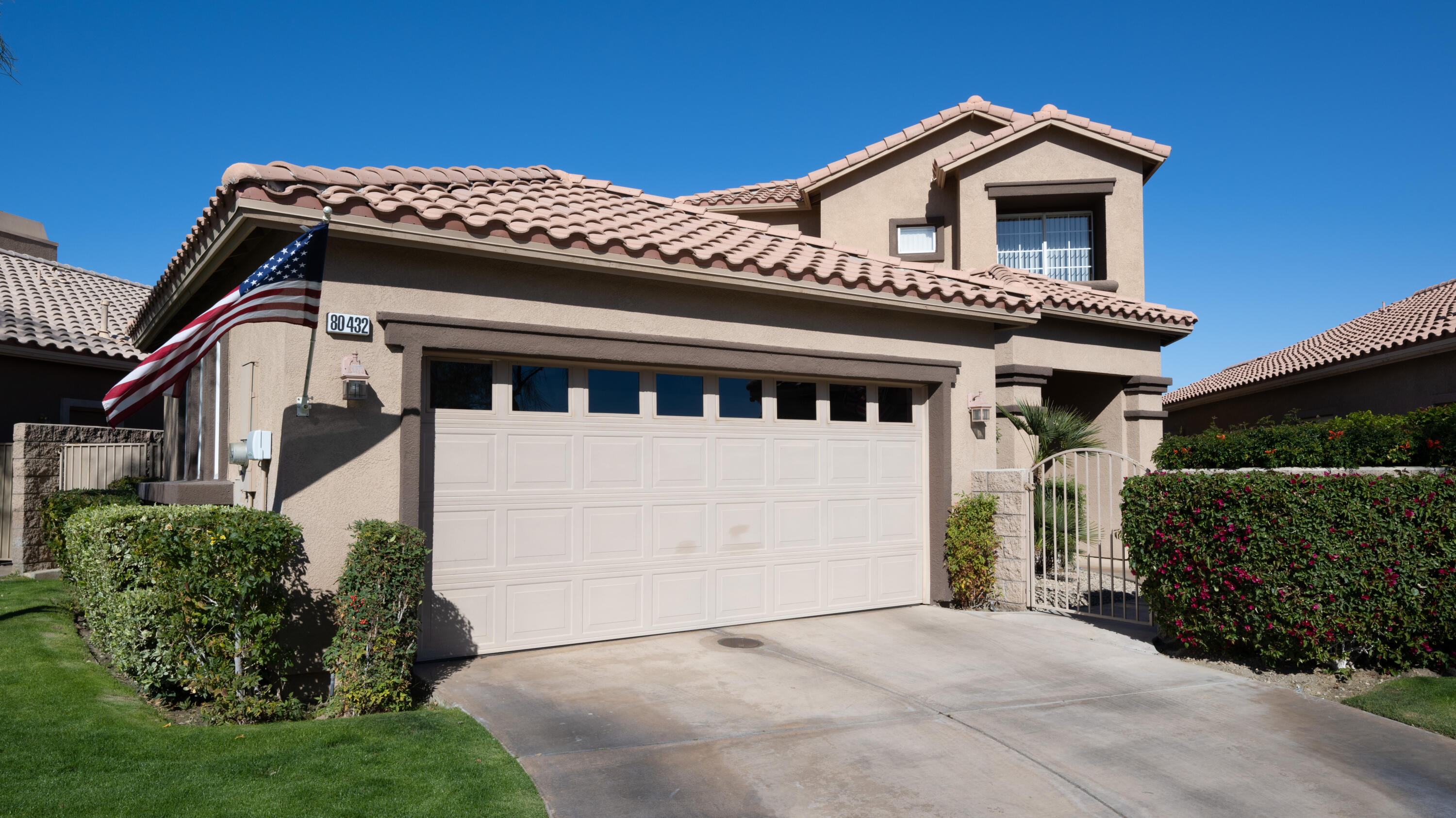 80432 Pebble Beach Drive Indio, CA 92201 - Photo 4 of 46 a front view of a house with a garage