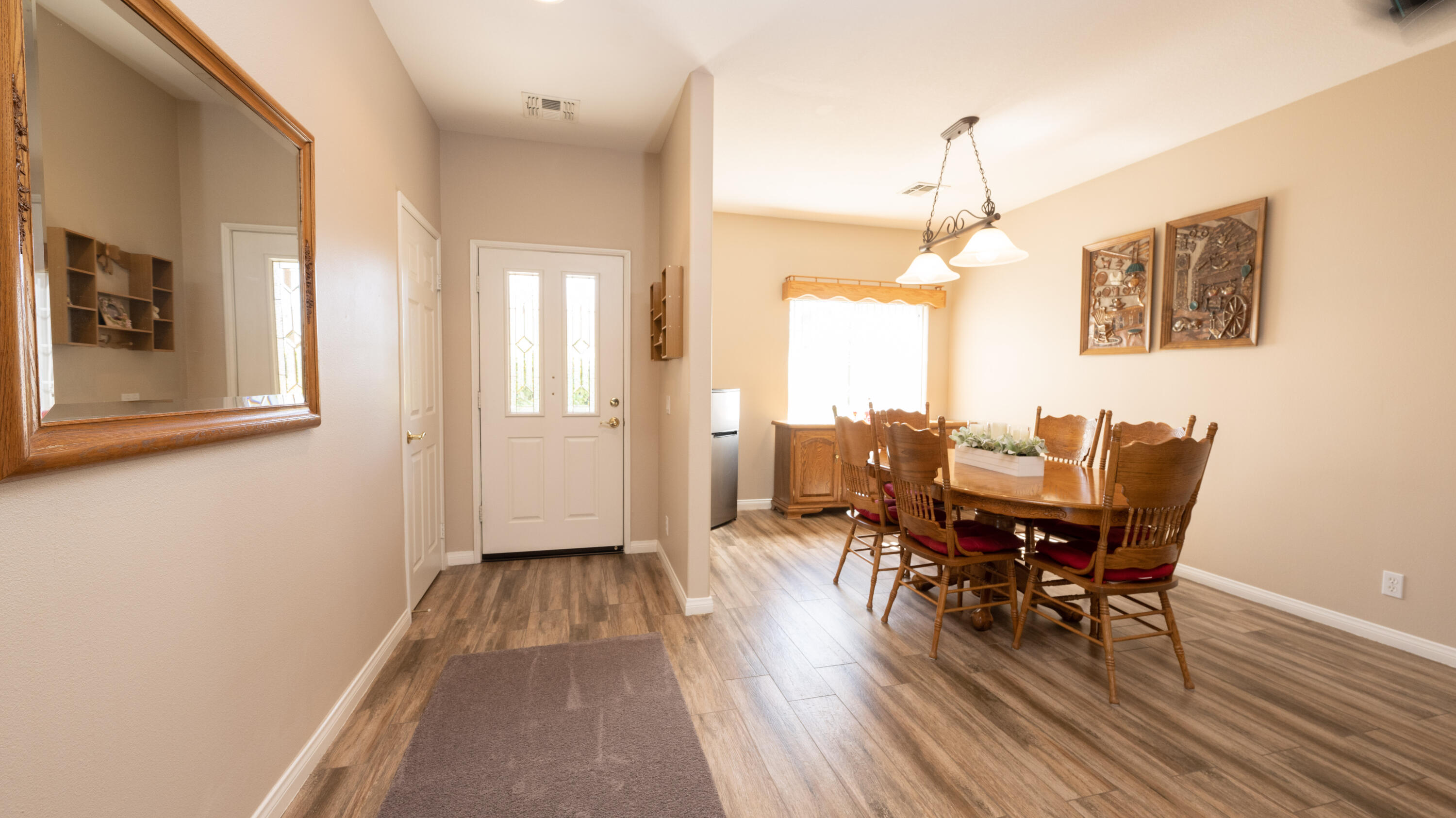 80432 Pebble Beach Drive Indio, CA 92201 - Photo 7 of 46 a view of a dining room with furniture and wooden floor