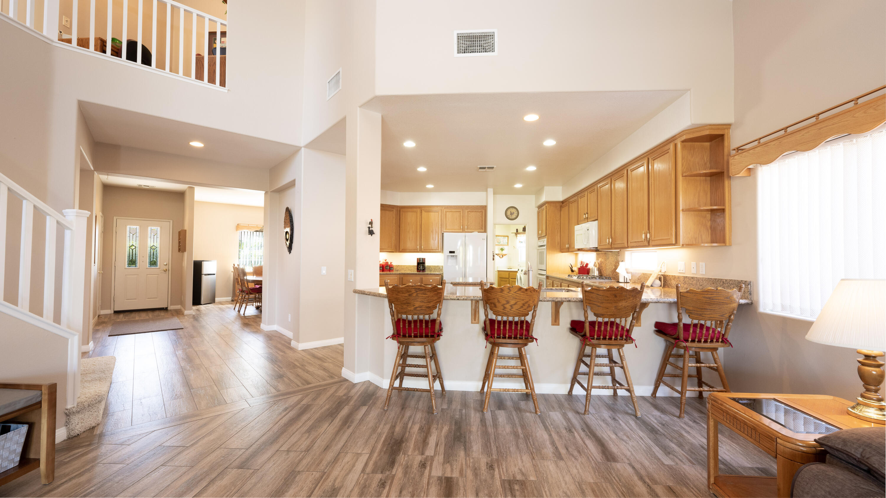 80432 Pebble Beach Drive Indio, CA 92201 - Photo 10 of 46 a view of a dining room with furniture and wooden floor