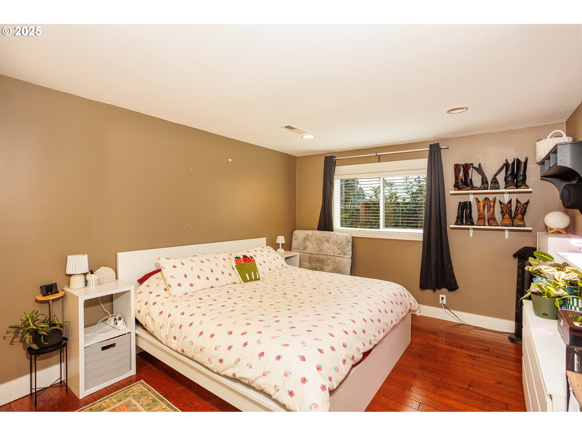 11511 Southeast Division Street Portland, OR 97266 - Photo 11 of 21 a bedroom with a bed and a window