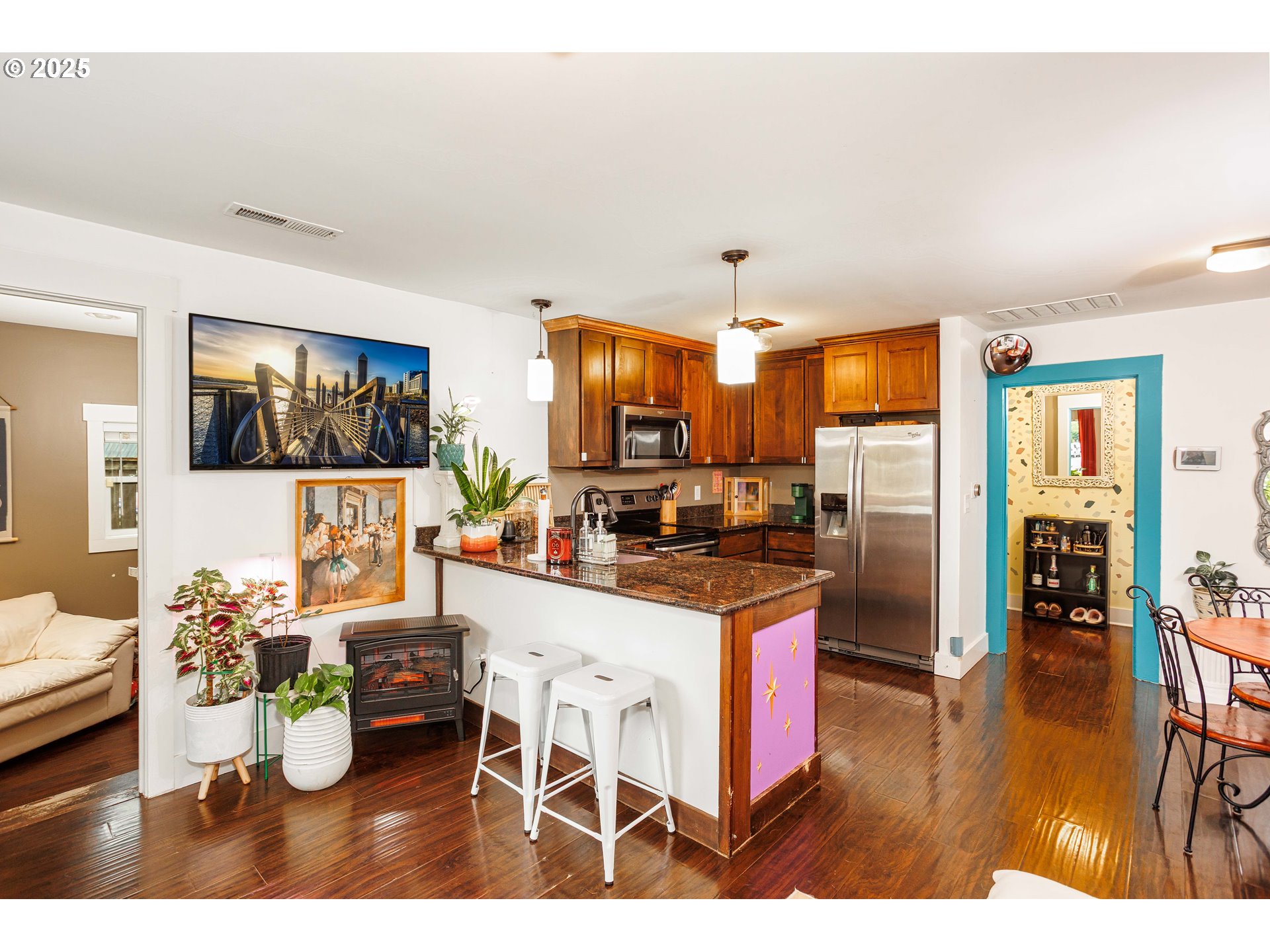 11511 Southeast Division Street Portland, OR 97266 - Photo 7 of 21 a kitchen with a refrigerator and a dining table