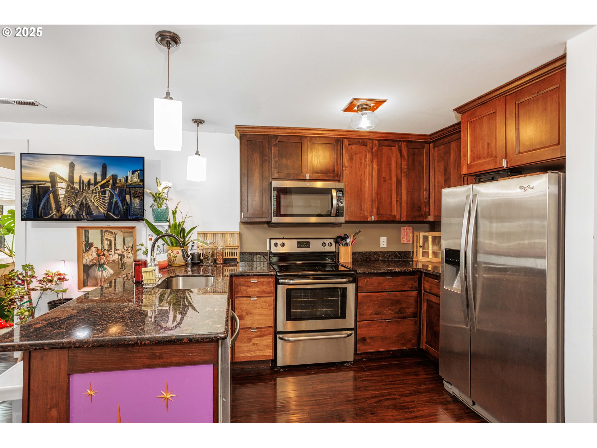 11511 Southeast Division Street Portland, OR 97266 - Photo 9 of 21 a kitchen with stainless steel appliances granite countertop a refrigerator a stove a sink and a microwave