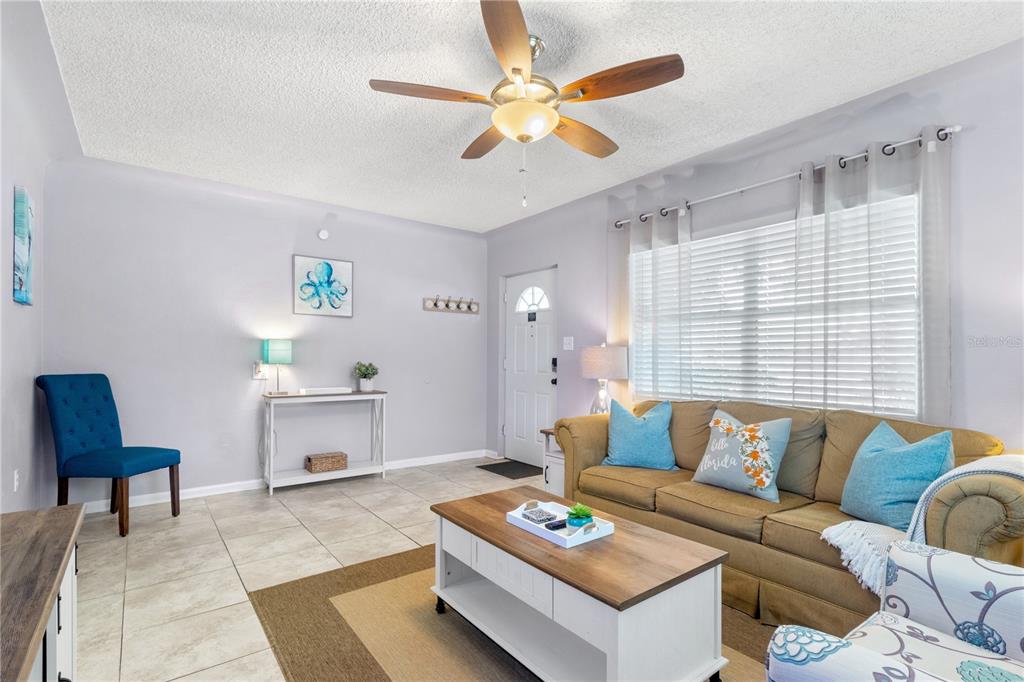 5596 100th Way North St. Petersburg, FL 33708 - Photo 6 of 67 a living room with furniture and a couch