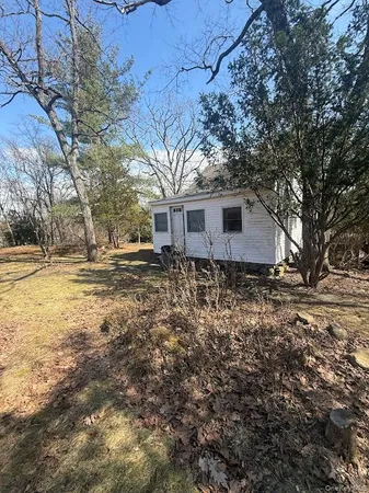 a front view of house with small garden