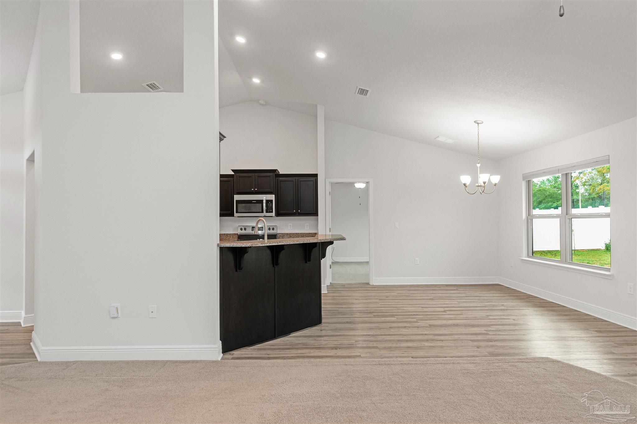 3626 Ranch Drive Crestview, FL 32539 - Photo 11 of 29 a kitchen with stainless steel appliances a refrigerator sink and microwave