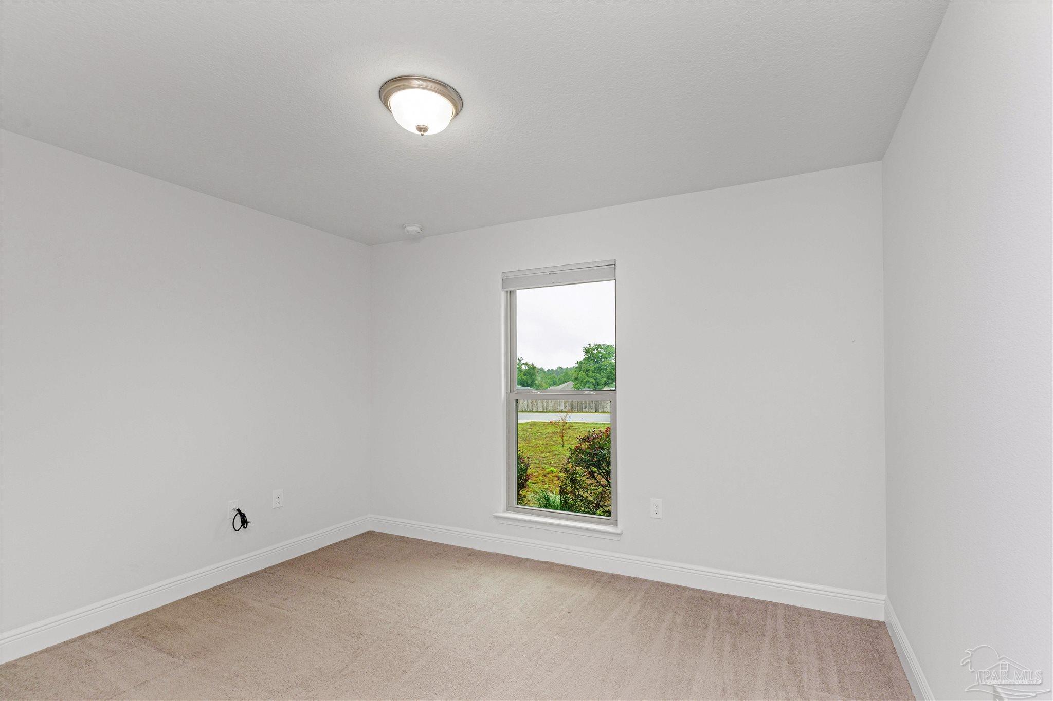 3626 Ranch Drive Crestview, FL 32539 - Photo 20 of 29 an empty room with windows