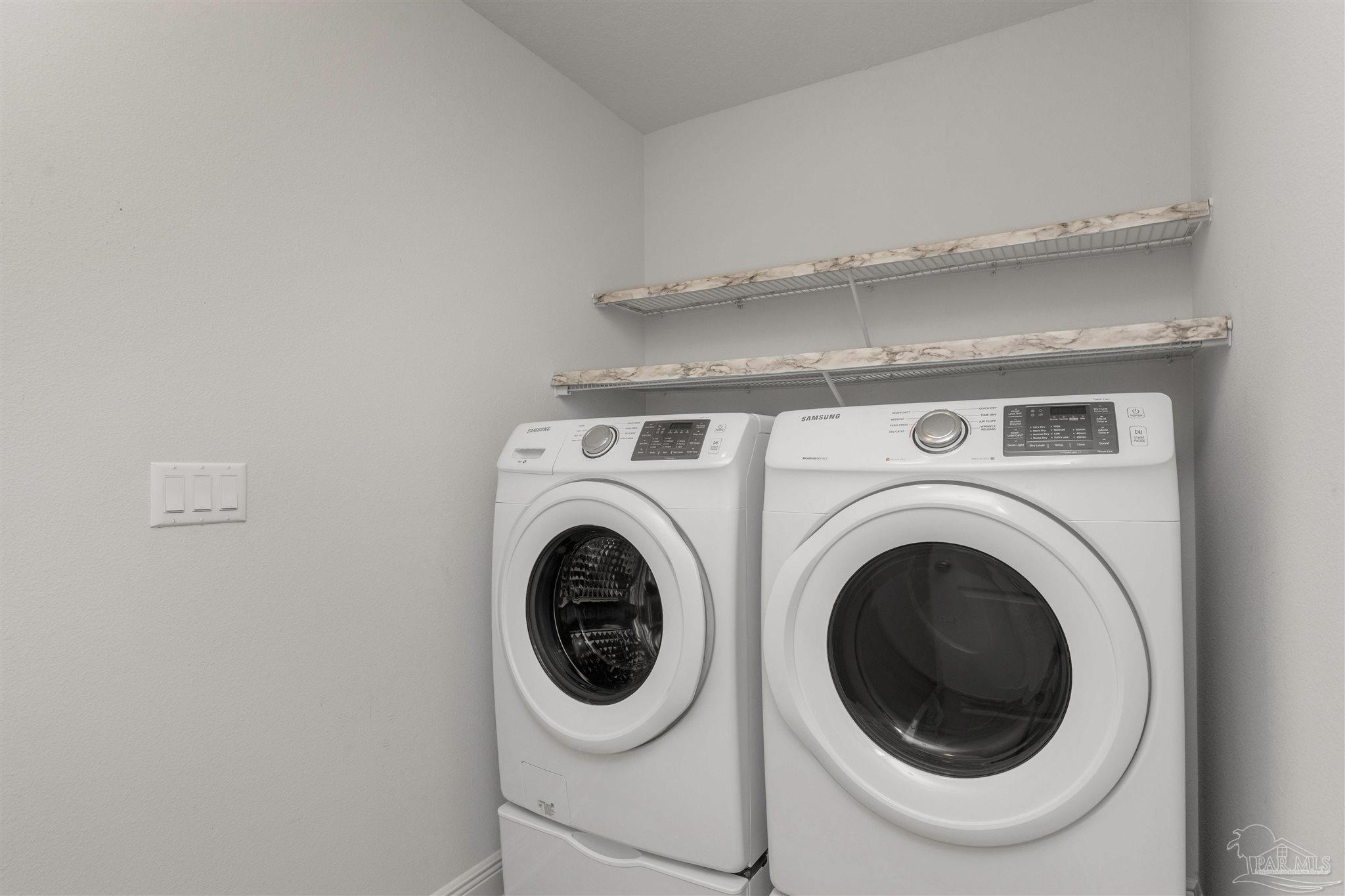 3626 Ranch Drive Crestview, FL 32539 - Photo 26 of 29 a utility room with dryer and washer