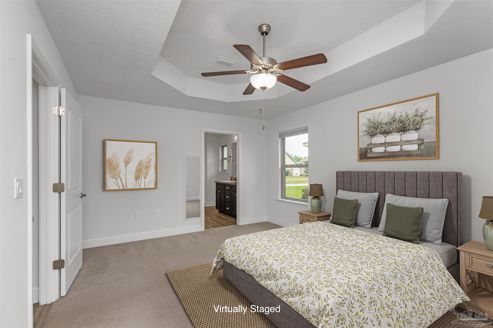 3626 Ranch Drive Crestview, FL 32539 - Photo 6 of 29 a bedroom with a large bed and a chandelier