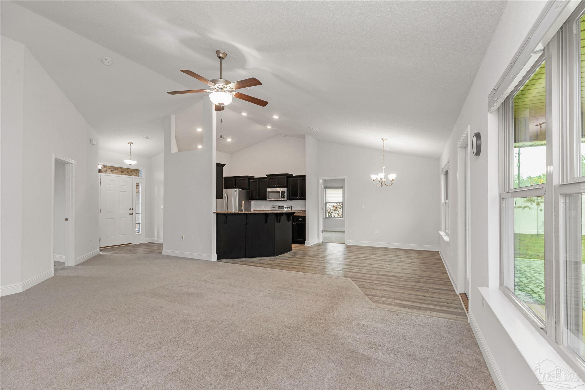 3626 Ranch Drive Crestview, FL 32539 - Photo 8 of 29 a view of a kitchen with a sink and a refrigerator