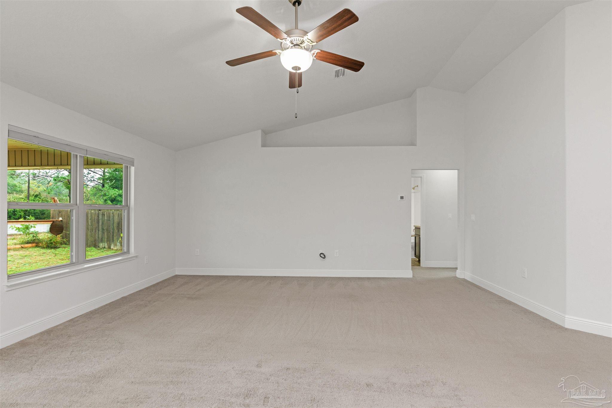 3626 Ranch Drive Crestview, FL 32539 - Photo 10 of 29 an empty room with a window and a ceiling fan