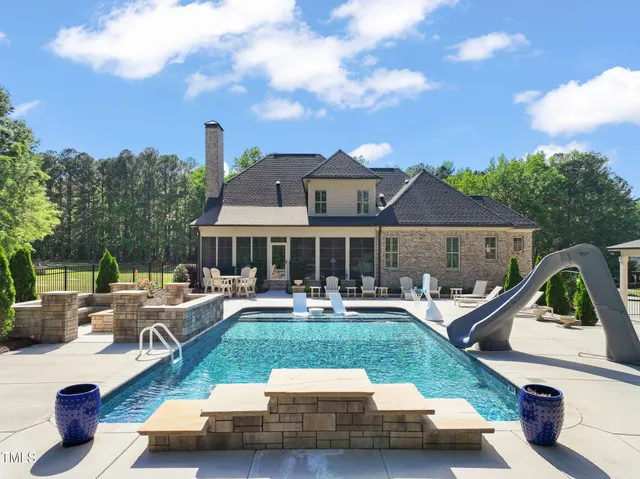 a view of a house with swimming pool