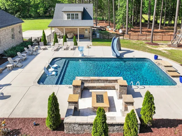 a large kitchen with a table and chairs