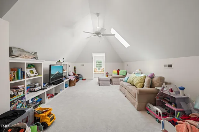 an aerial view of a house with swimming pool garden and patio