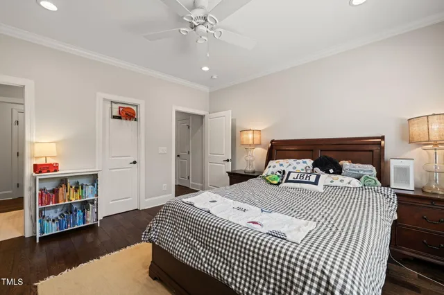 an aerial view of a house with swimming pool garden and patio