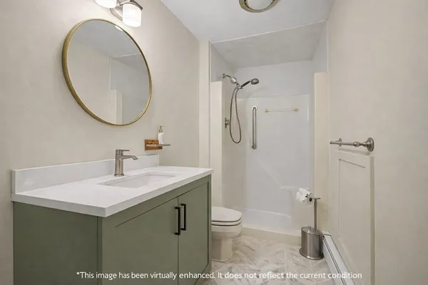 a bathroom with a toilet a sink and a mirror