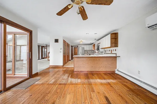 an empty room with furniture and a fireplace