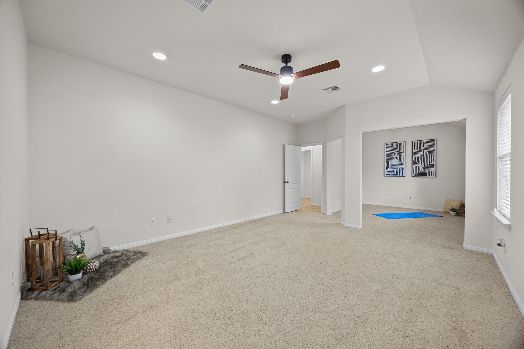 1317 Rimstone Drive Cedar Park, TX 78613 - Photo 21 of 32 Unfurnished bedroom with light colored carpet, recessed lighting, a ceiling fan, and vaulted ceiling